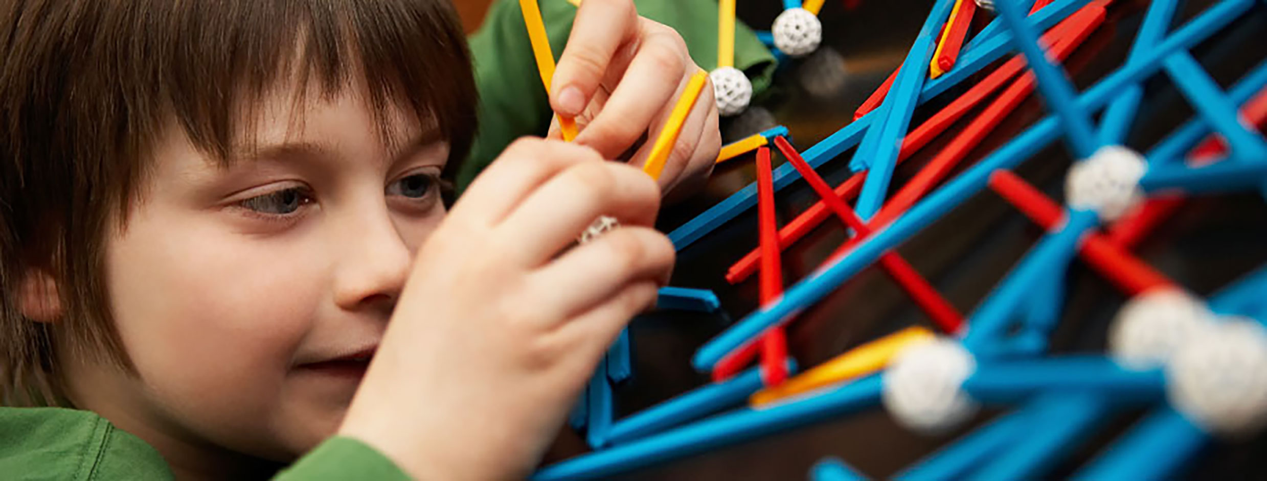 Child playing with connect toys.